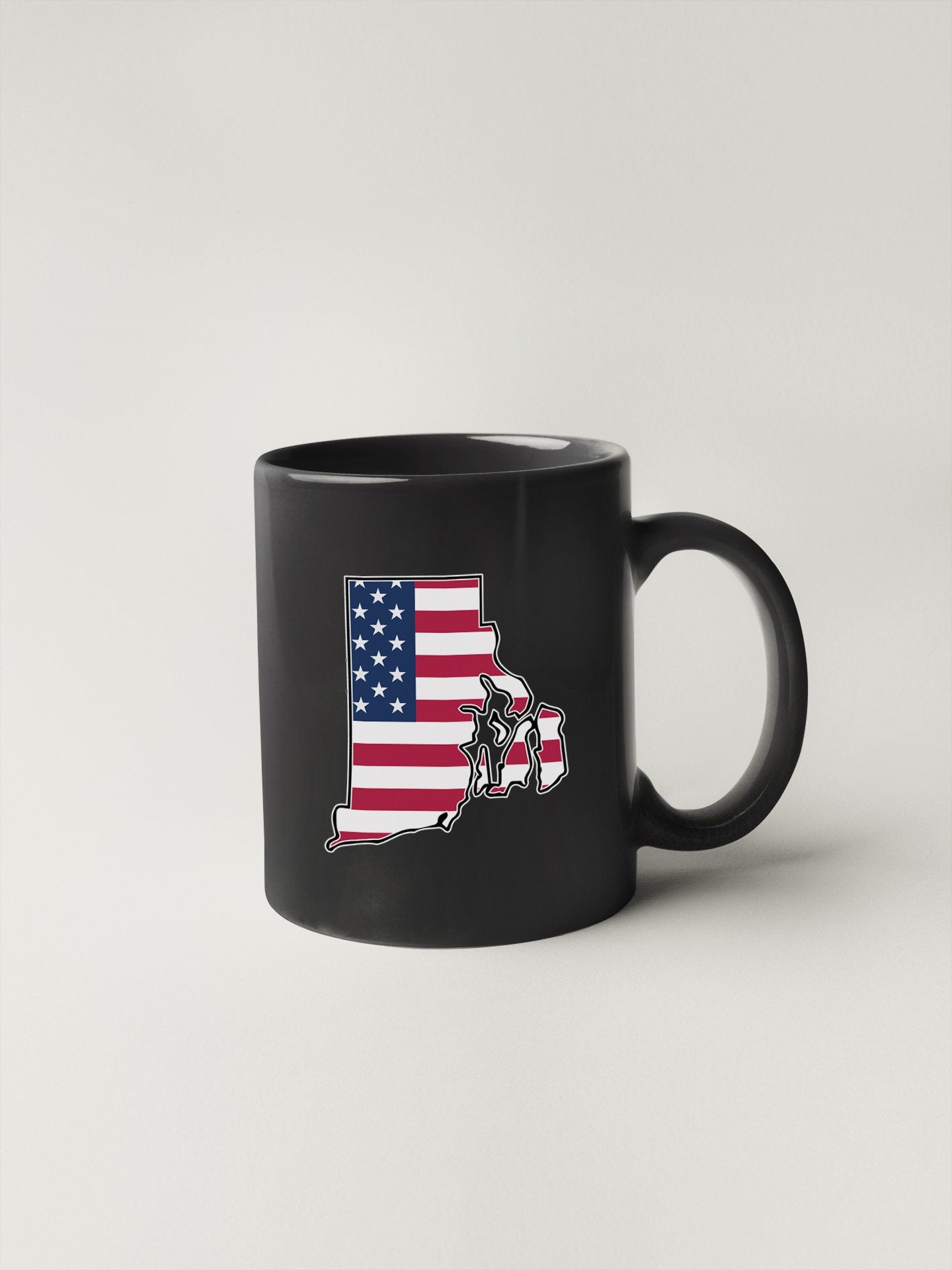 a black coffee mug with the state of texas painted on it