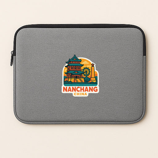 A gray laptop sleeve with a colorful sticker depicting a temple and the text "Nanchang China".