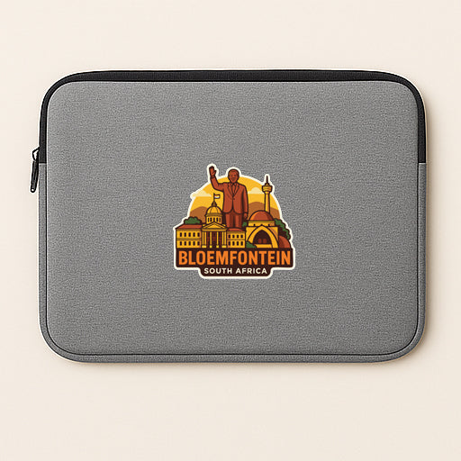 A gray laptop sleeve with a sticker depicting a city skyline and a person.