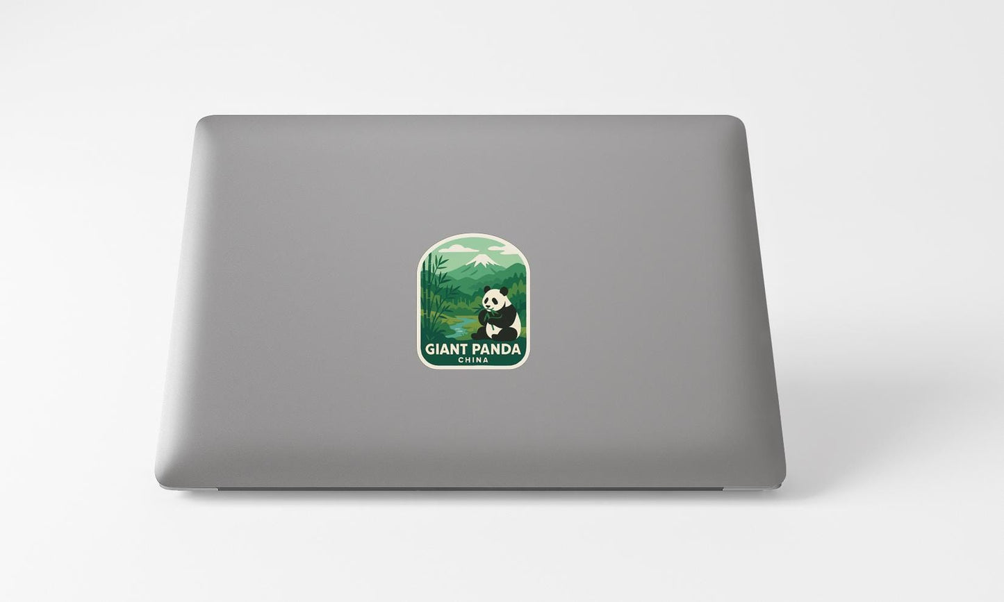 A sticker of a panda bear on a laptop.