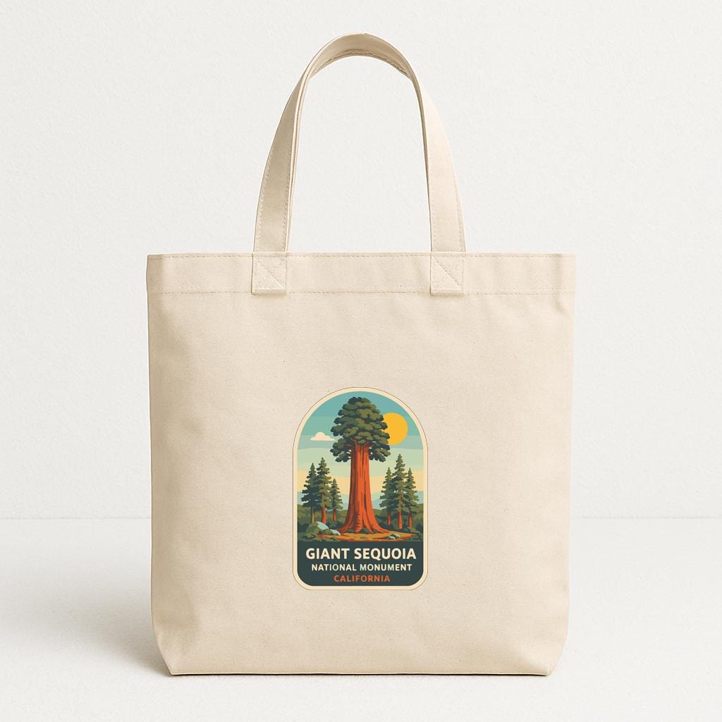 A beige tote bag with a printed label that says "Giant Sequoia National Monument California".