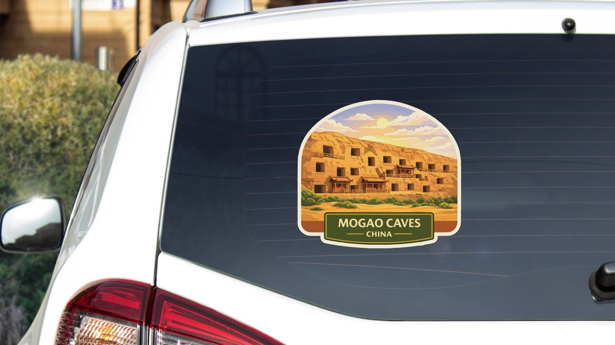a sticker on the rear window of a car that depicts the Mogao Caves in China.