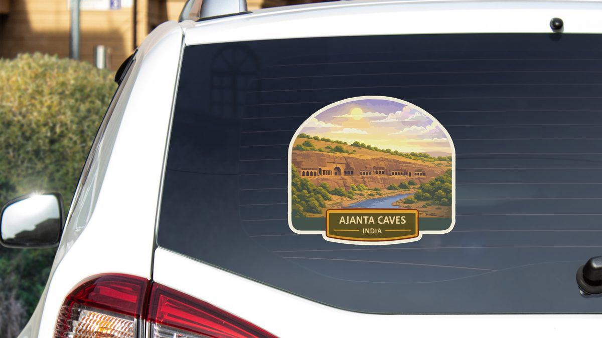 a sticker on the rear window of a car, depicting the Ajanta Caves in India.