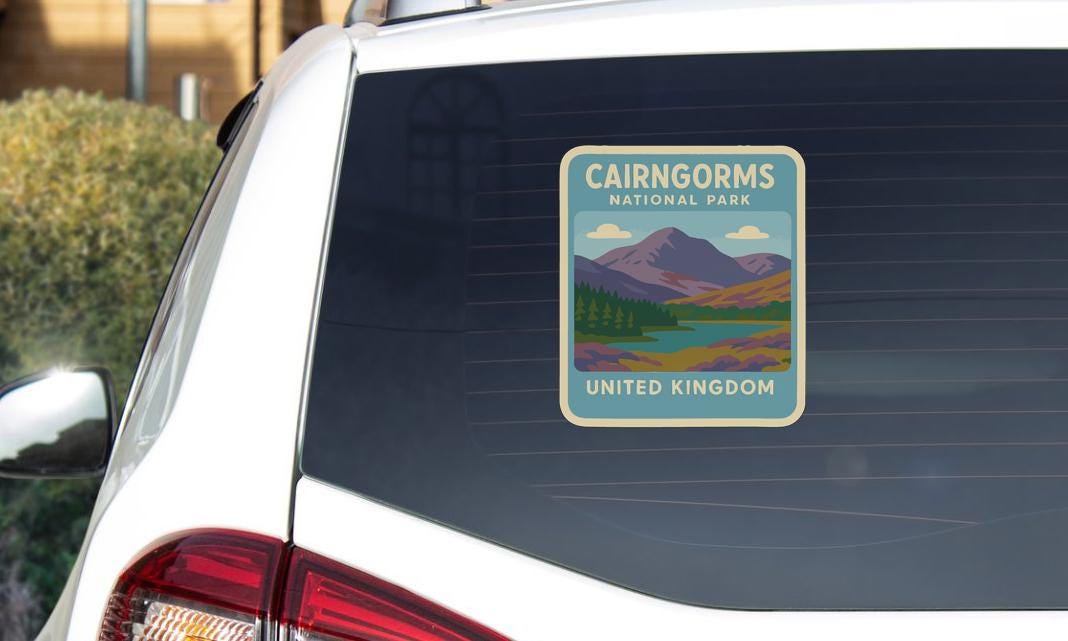 a sticker on the rear window of a car that says "CAIRWORMS NATIONAL PARK UNITED KINGDOM".