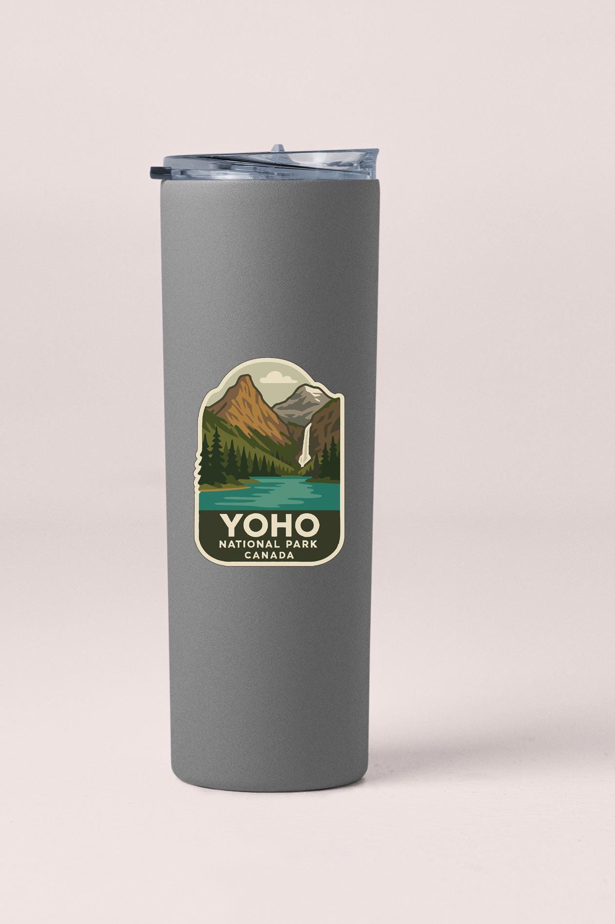 A gray insulated tumbler with a label that says "YOHO NATIONAL PARK CANADA".
