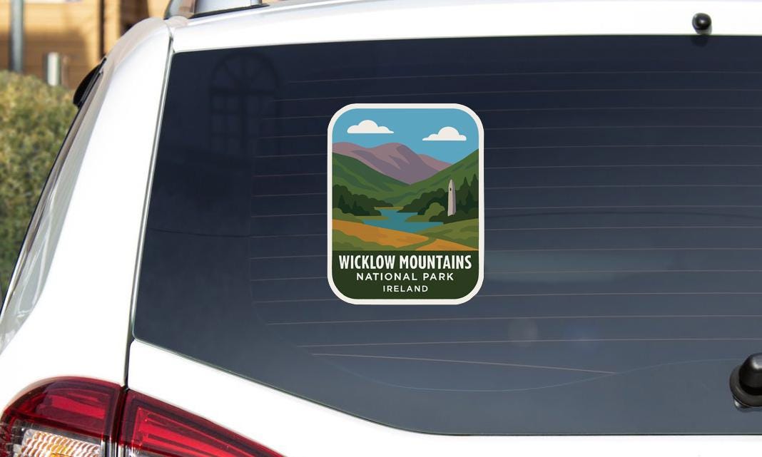 A sticker on the rear window of a car that says "Wicklow Mountains National Park, Ireland".