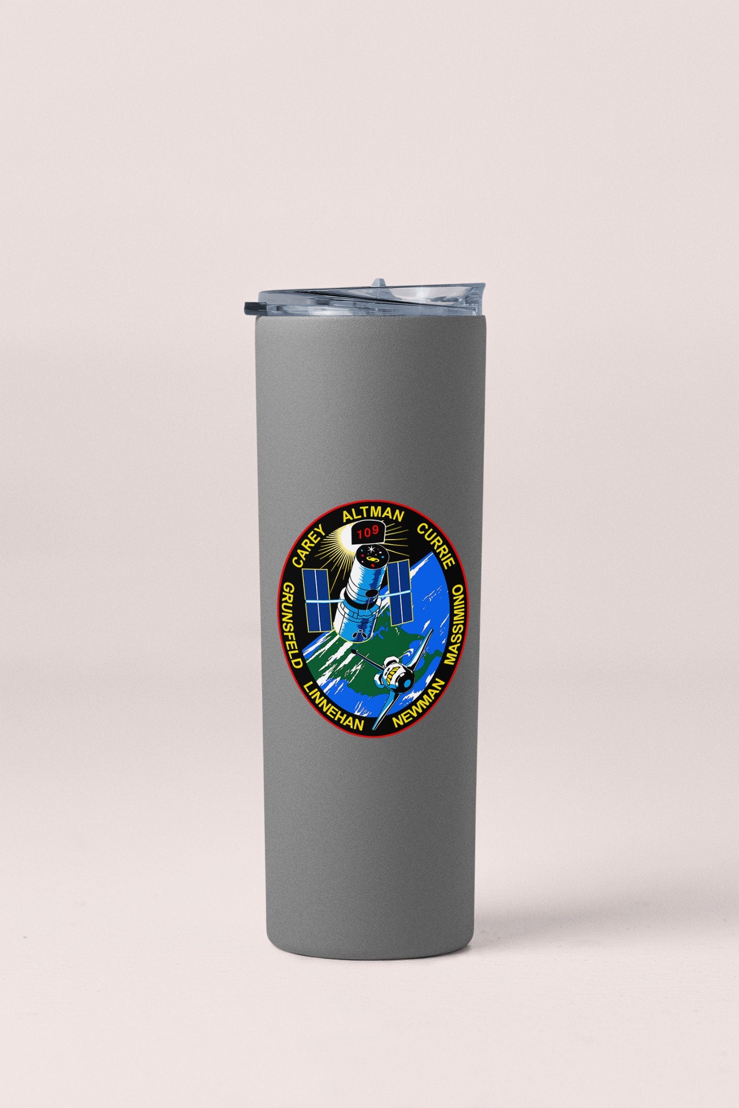 a travel mug with a nasa emblem on it