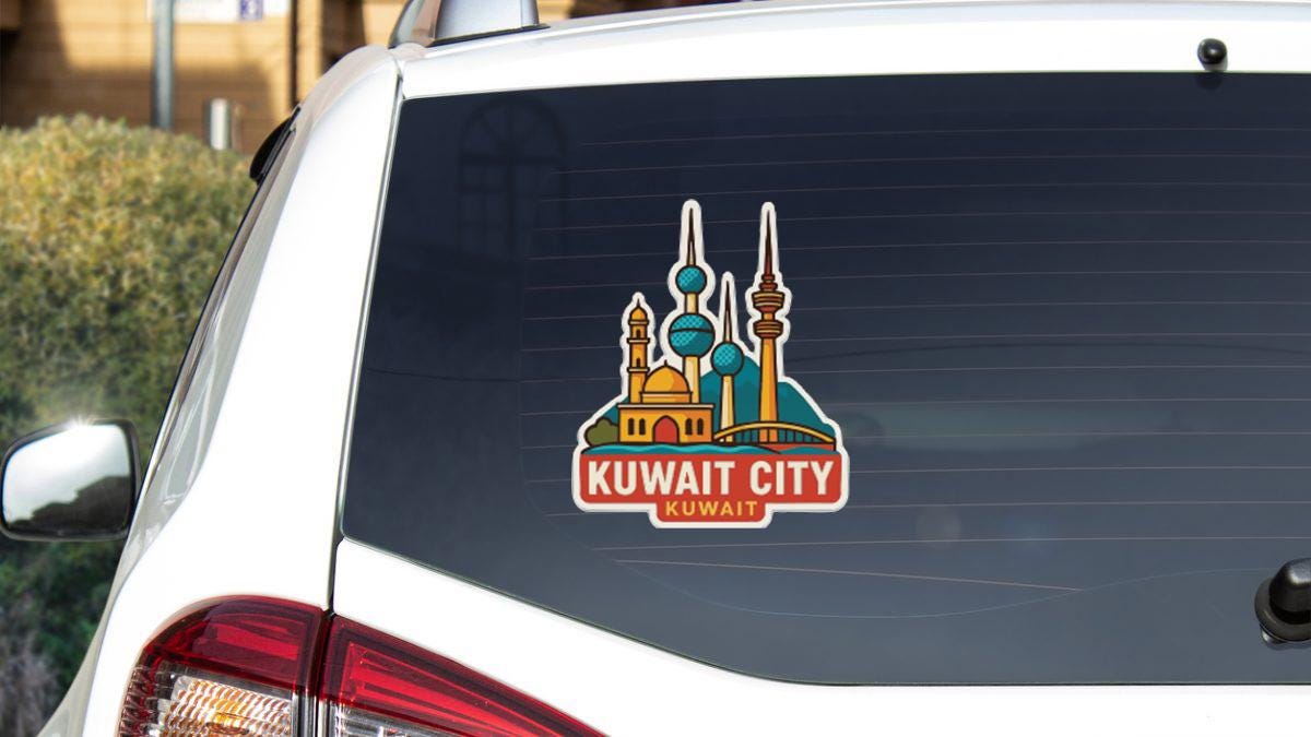 a sticker on the rear window of a car that displays the Kuwait City skyline.