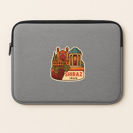 A gray laptop sleeve with a sticker depicting a landmark in Shiraz, Iran.