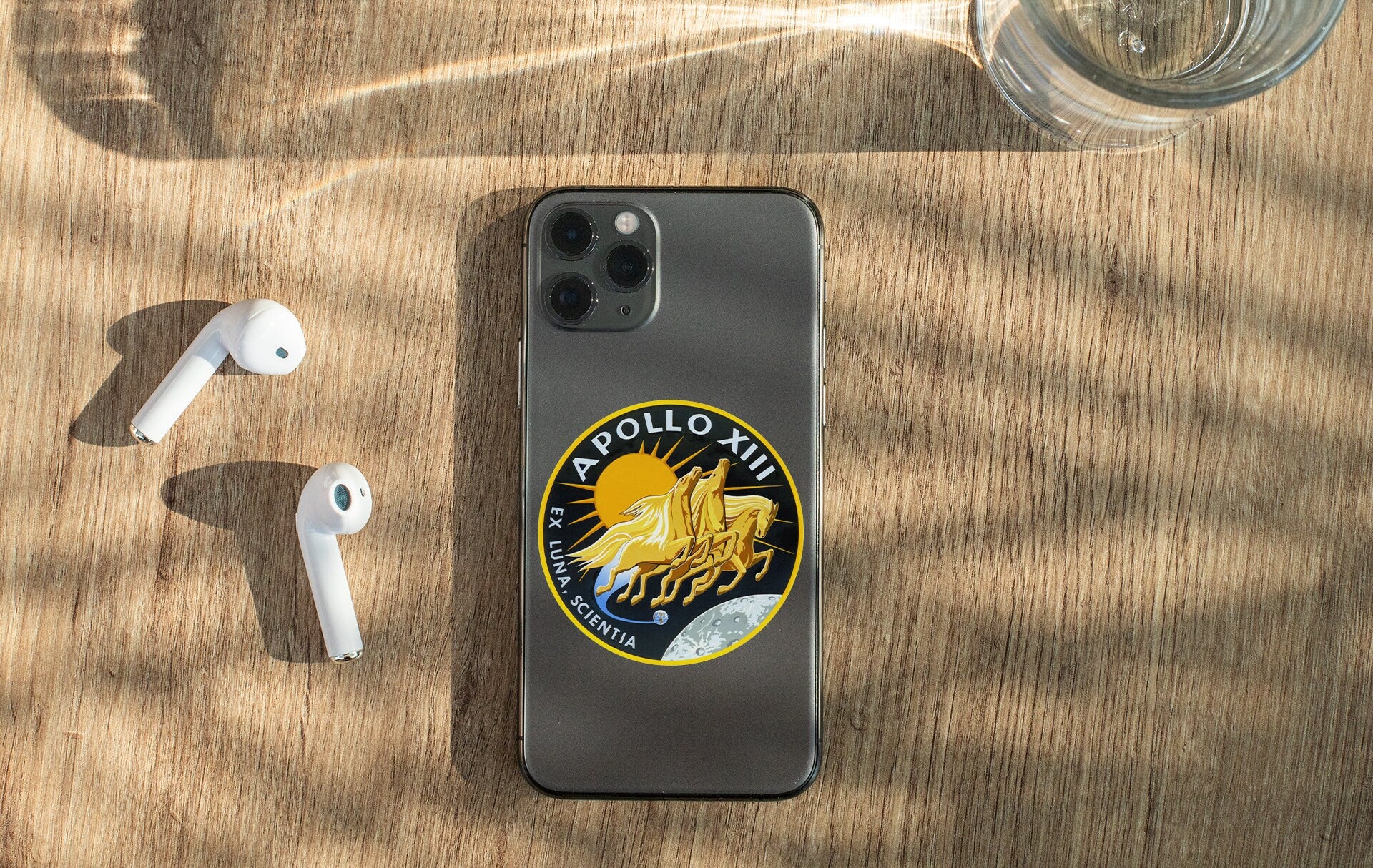 a cell phone sitting on top of a wooden table