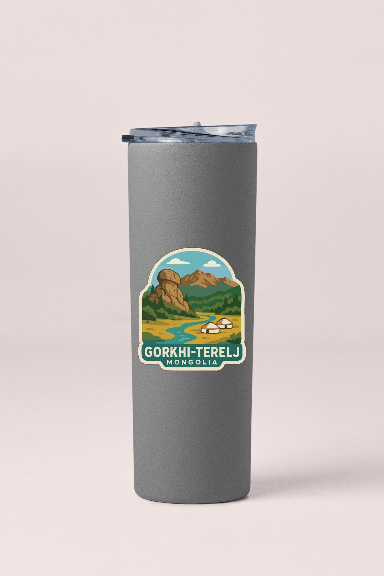 A gray insulated tumbler with a sticker depicting a scenic landscape and the text "Gorkhi-Terelj Mongolia".