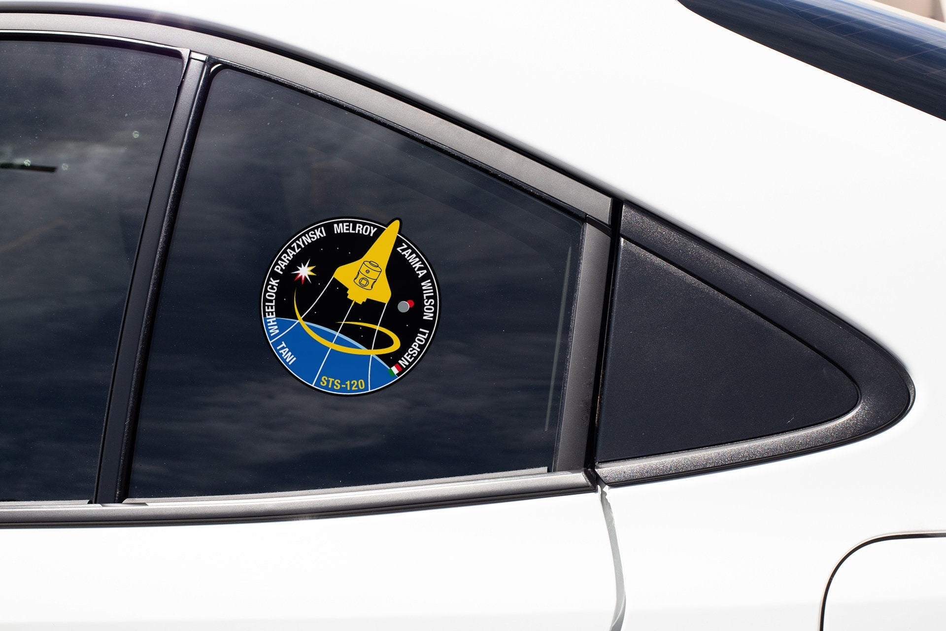 a close up of a car window with a sticker on it