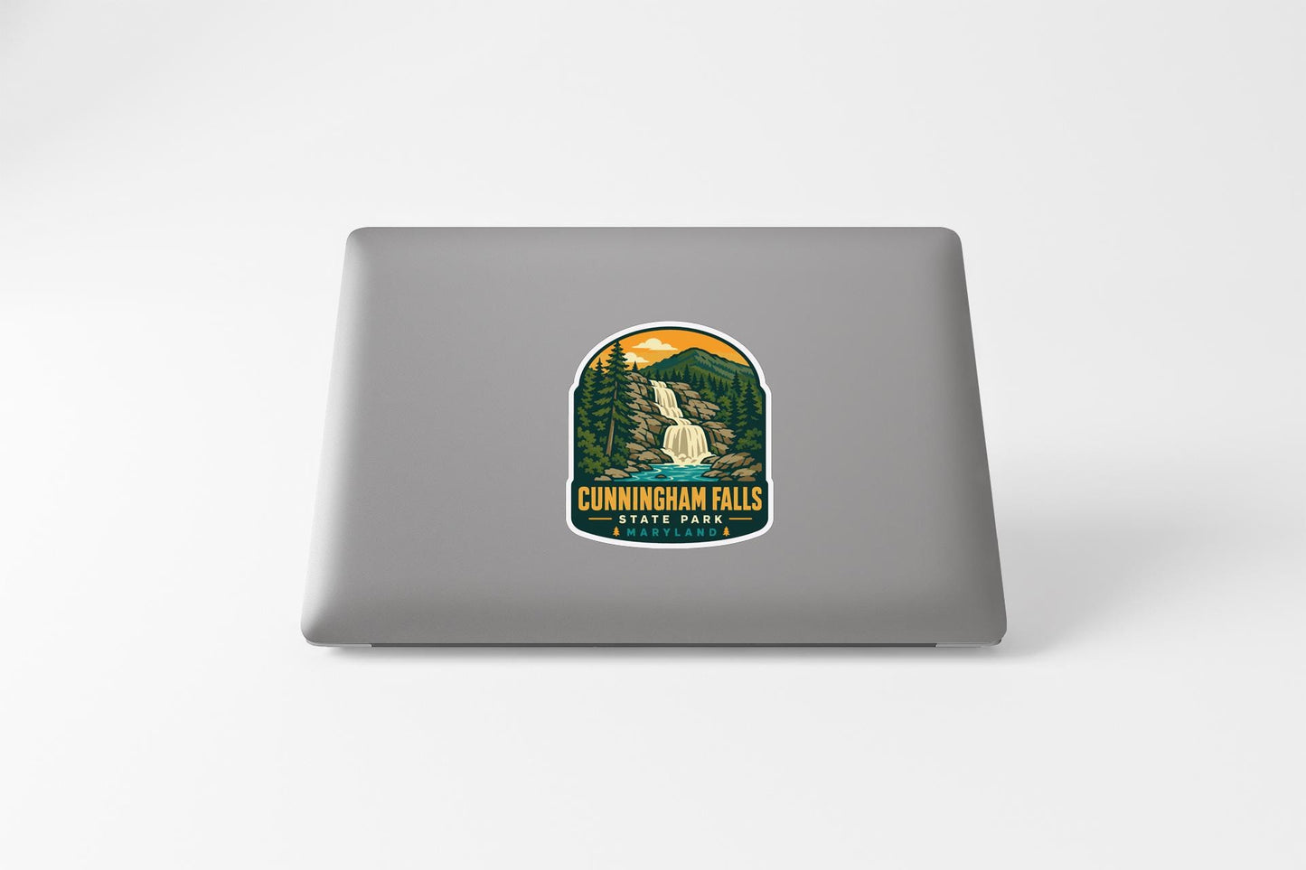 a sticker or decal of Cunningham Falls State Park on the back of a laptop computer.