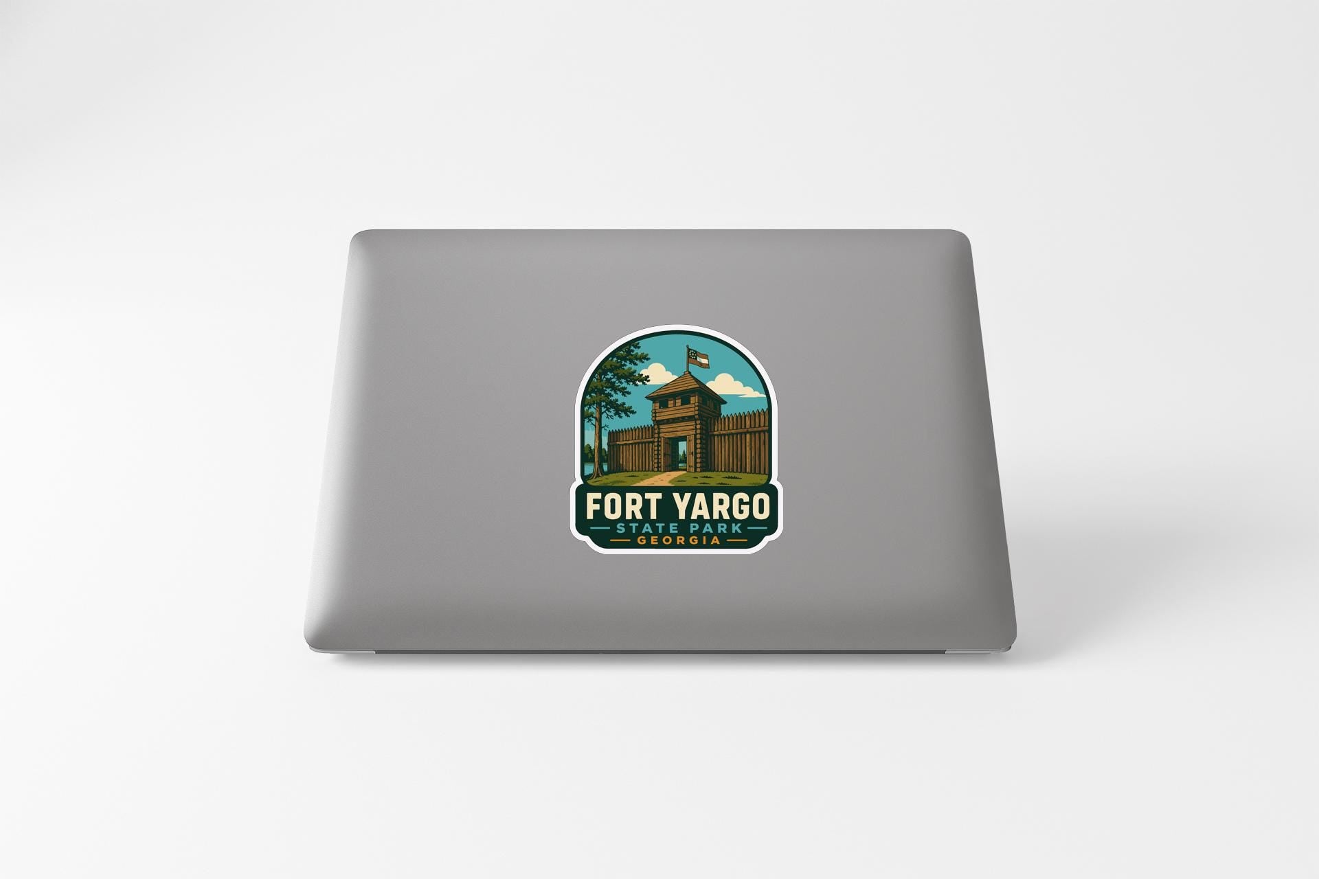 a sticker with a graphic of a building and the text "Fort Yargo State Park" on a laptop.