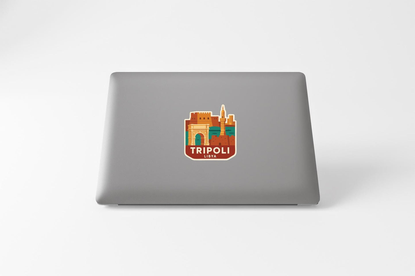 a sticker or decal of a city on the back of a laptop computer.