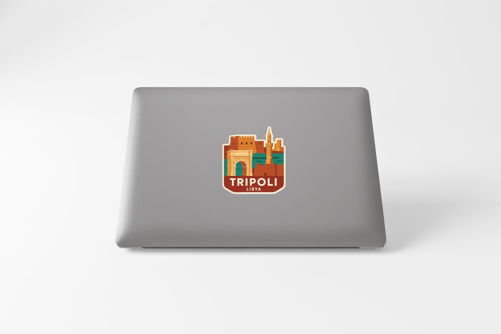 a sticker or decal of a city on the back of a laptop computer.