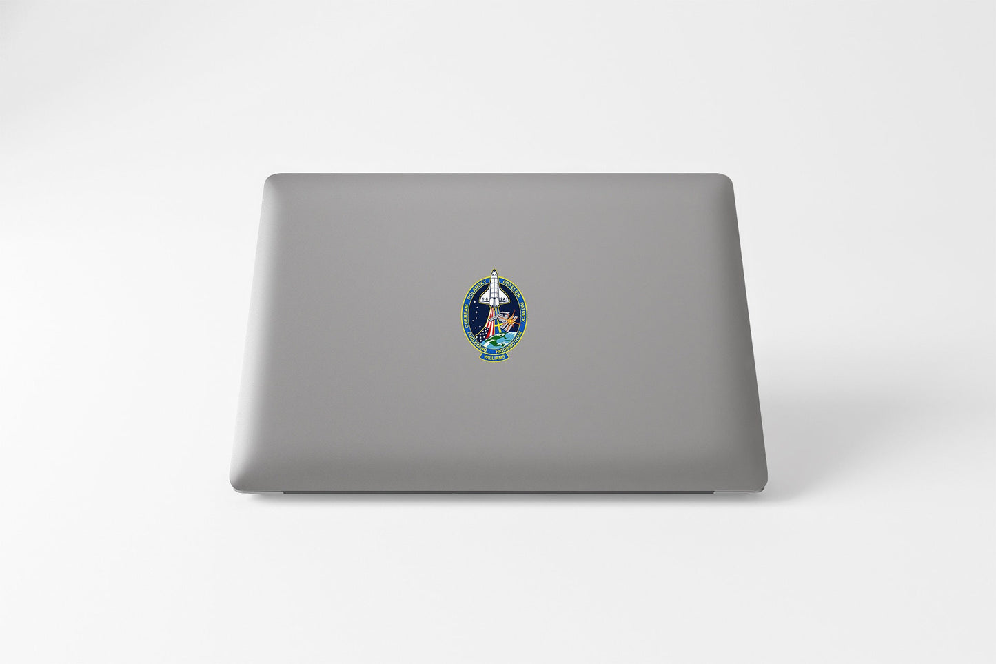 a laptop with a sticker of a picture of a woman