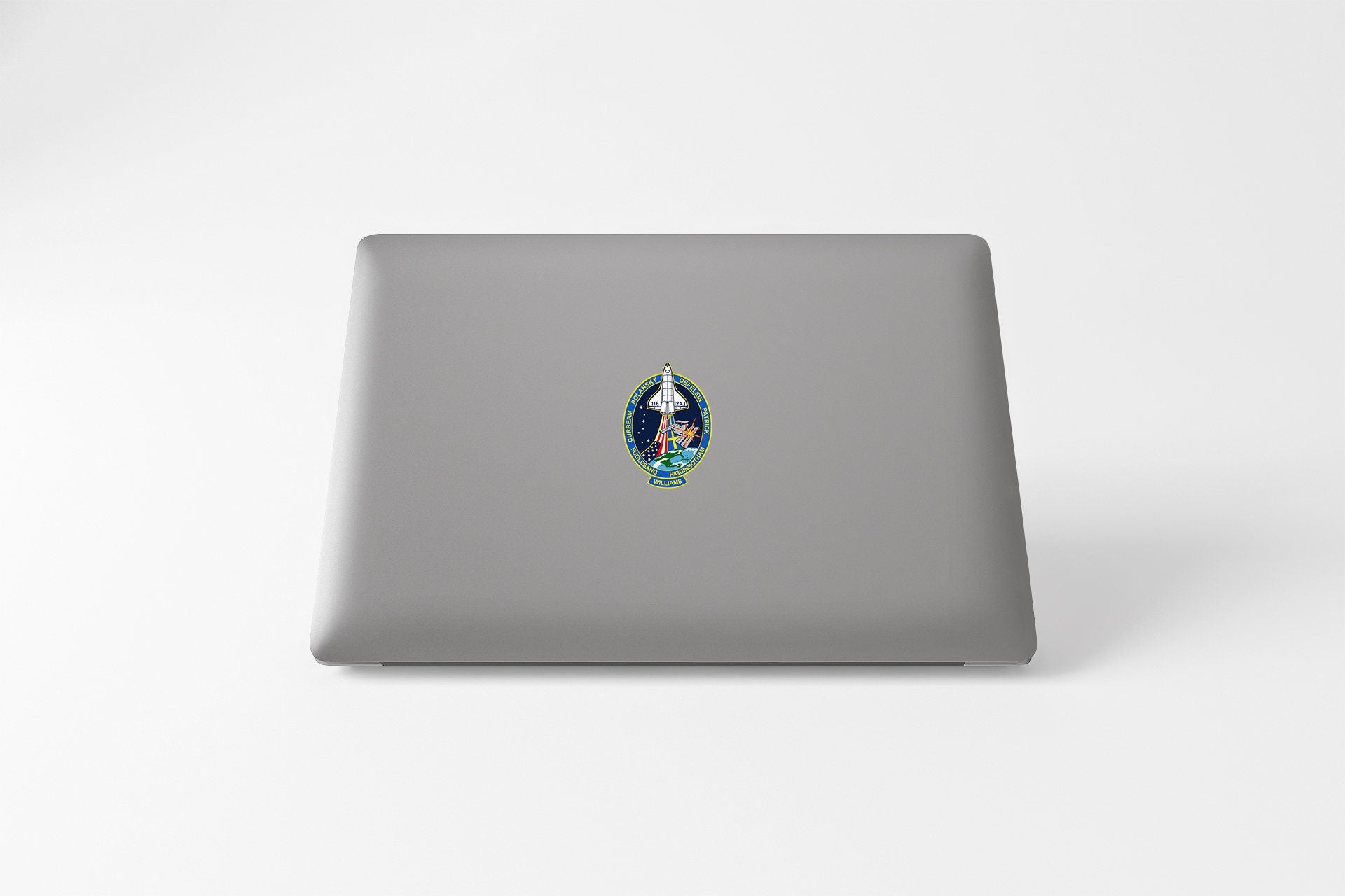 a laptop with a sticker of a picture of a woman