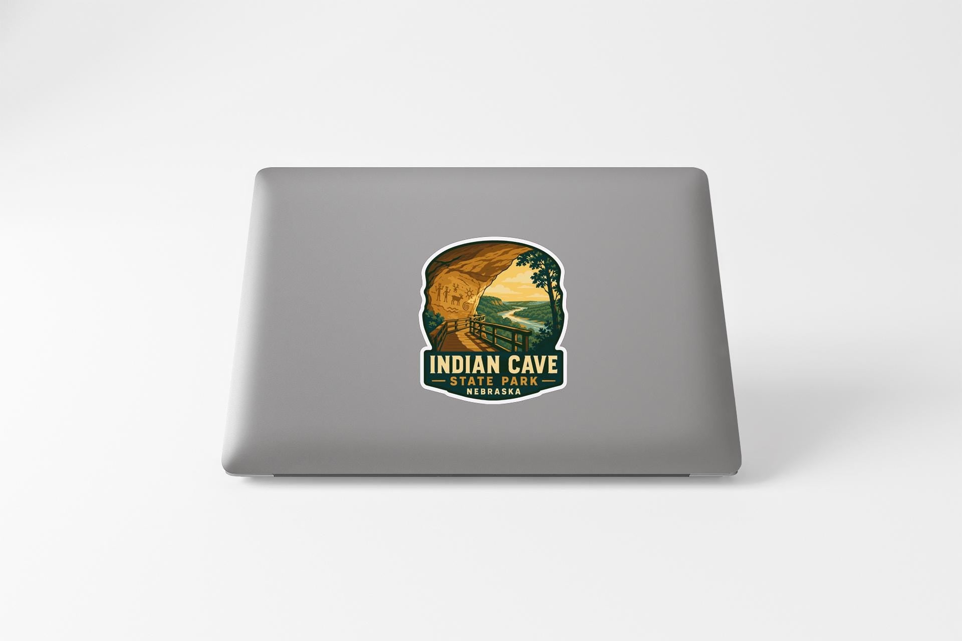 a sticker on a laptop that displays a scenic view of the Indian Cave State Park in Nebraska.