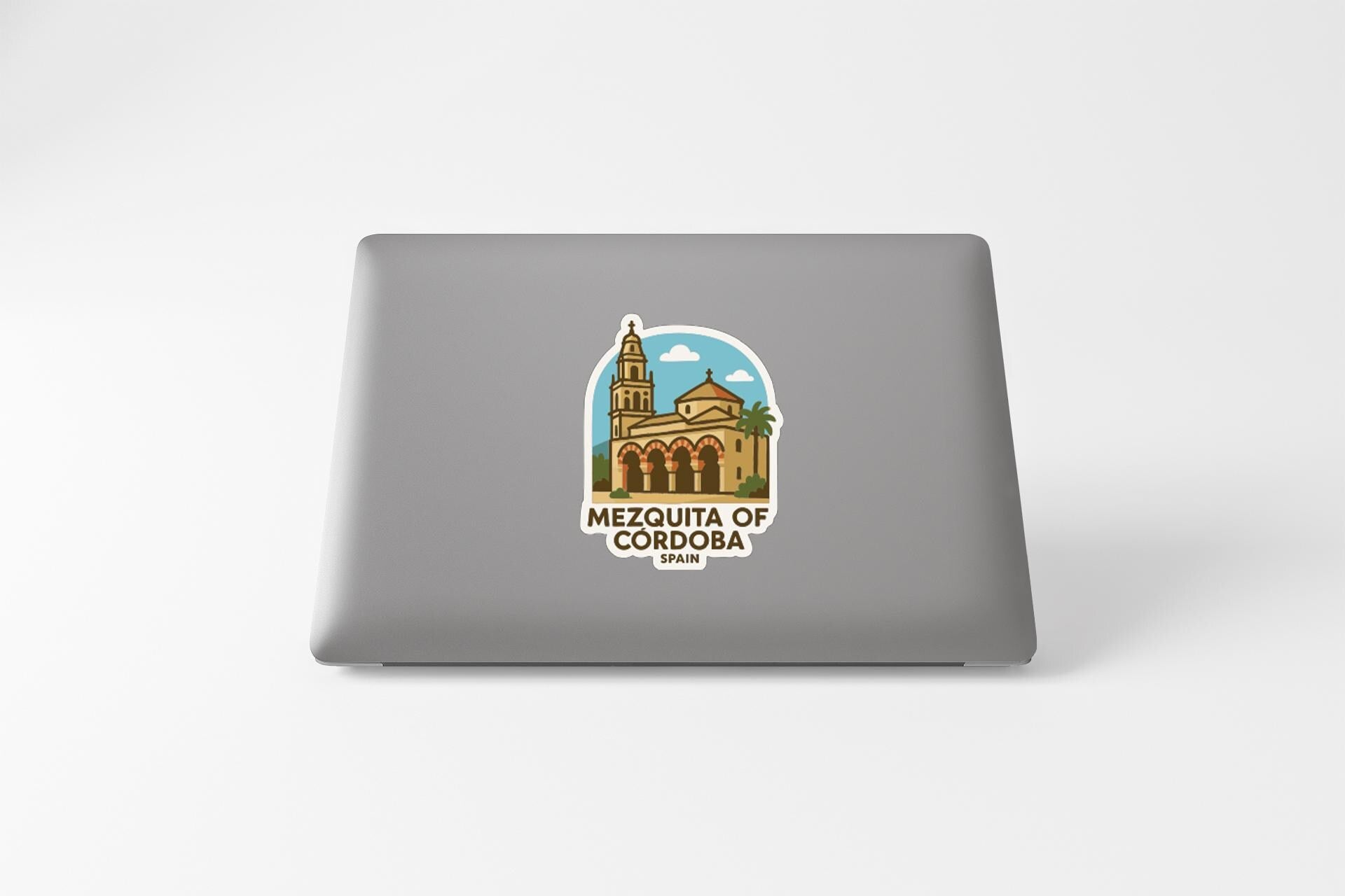 a sticker with an illustration of a building, specifically the Mezquita of Cordoba, a significant landmark in Tamaulipas, Mexico.