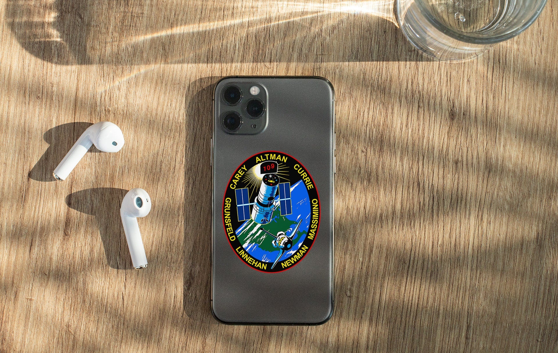 a cell phone sitting on top of a wooden table