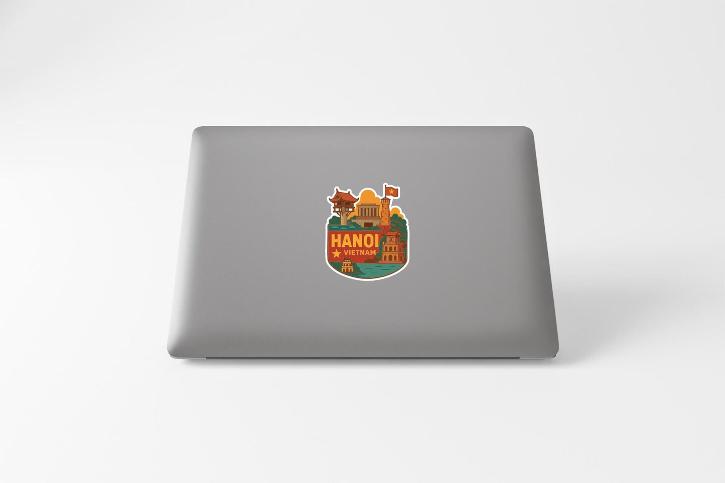 A sticker depicting a cityscape with the text "HANO I VETNAM" on it, which is a famous landmark in Vietnam.