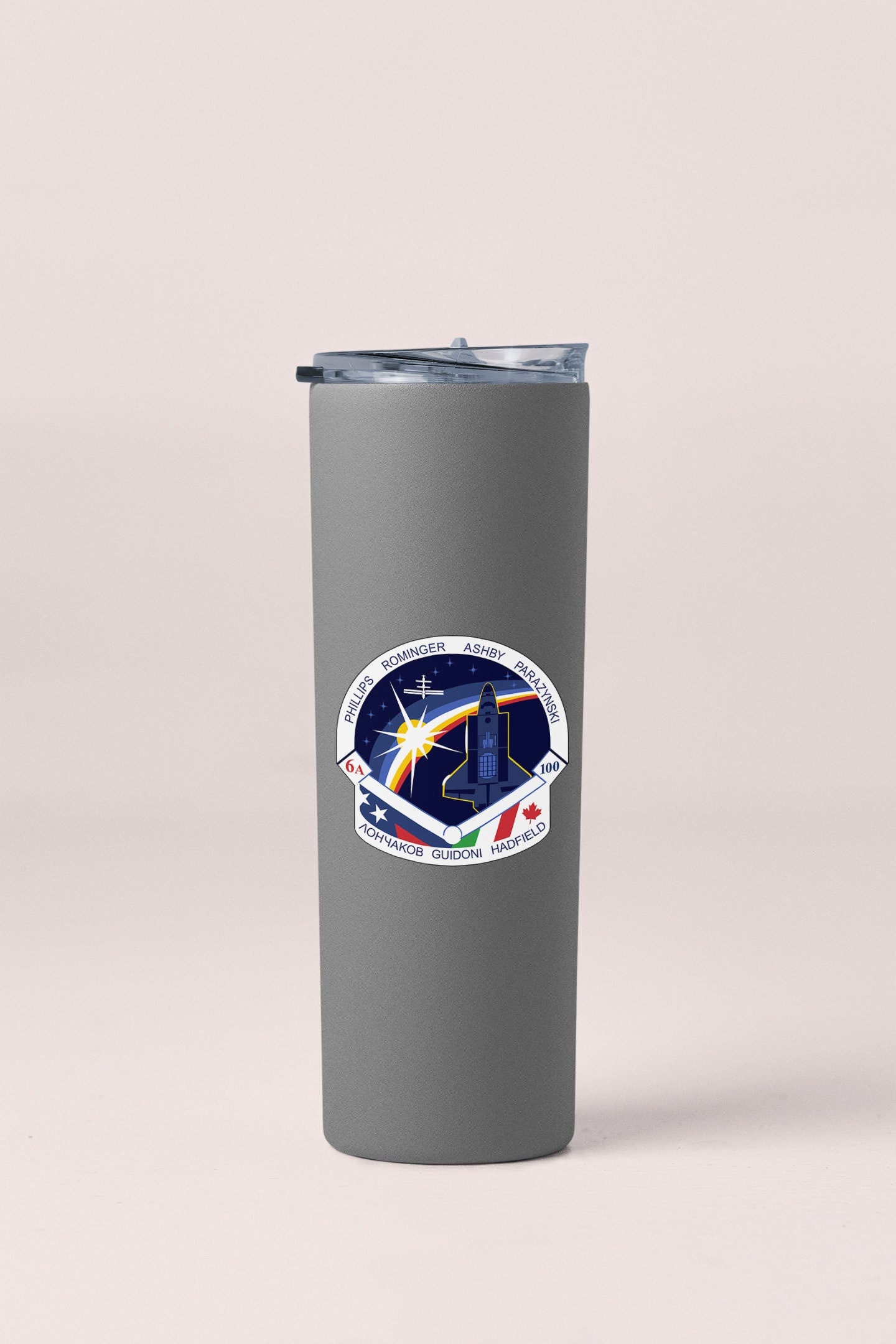 a stainless steel tumbler with a nasa emblem on it