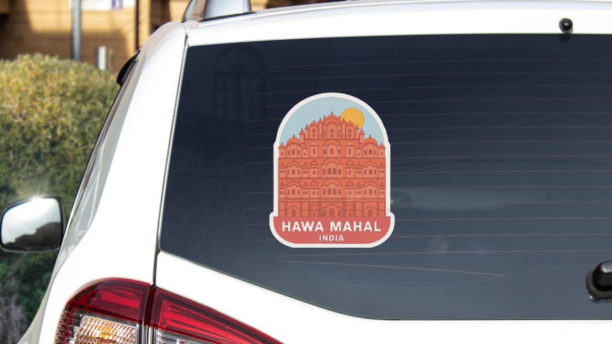 A sticker on the rear window of a car, depicting the Hawa Mahal, a famous landmark in India.