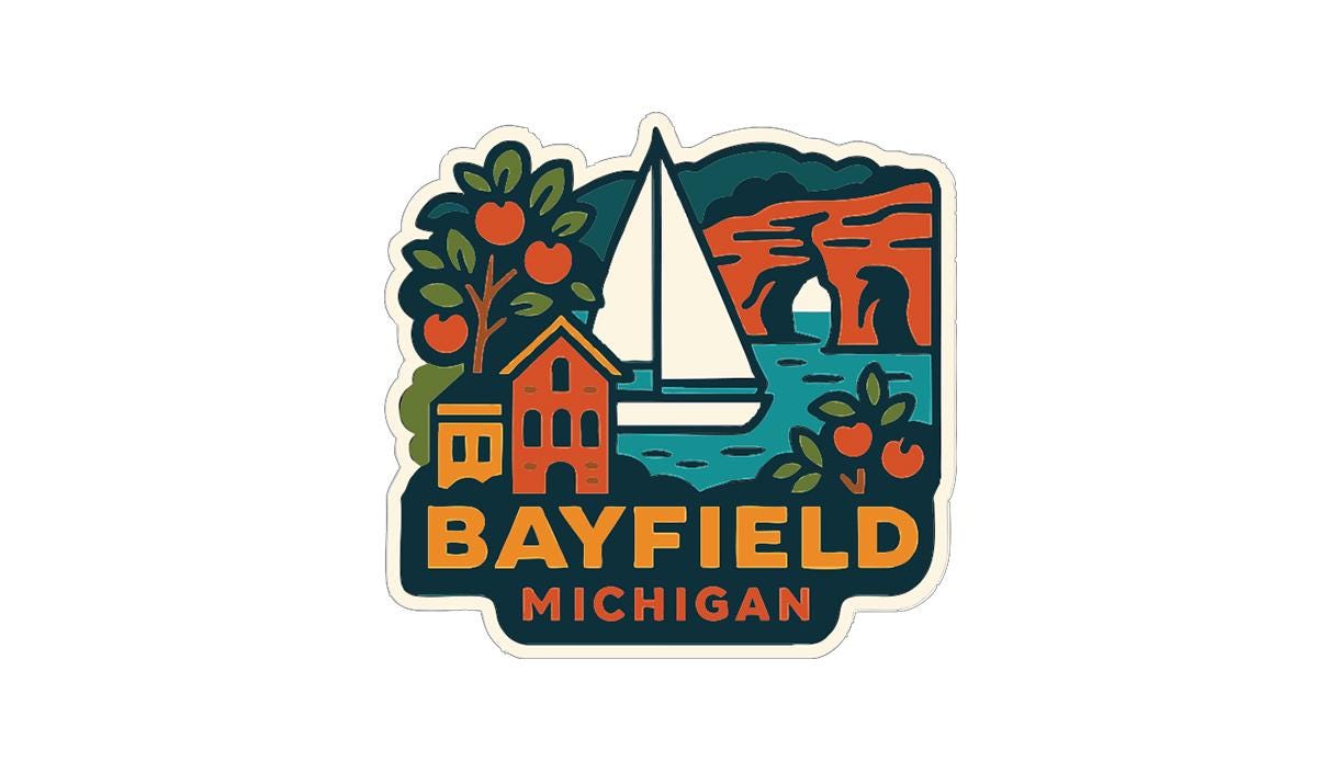A sticker or logo depicting a sailboat, buildings, and a scenic landscape with the text "BAYFIELD MICHIGAN" prominently displayed.