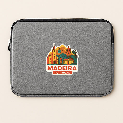 a gray laptop sleeve with a sticker depicting the city of Madeira, Portugal.