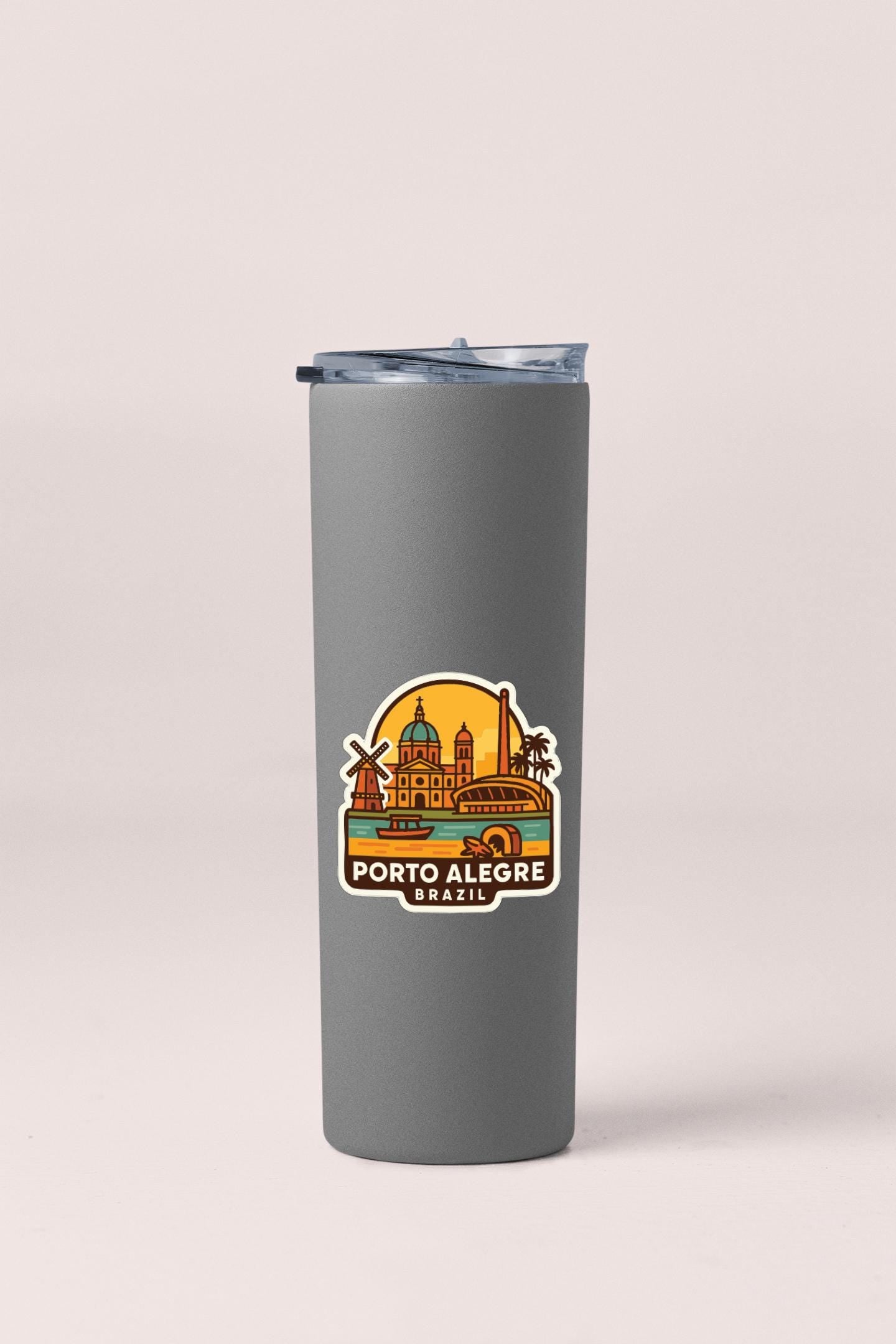 A gray insulated tumbler with a printed label depicting the cityscape of Porto Alegre, Brazil.