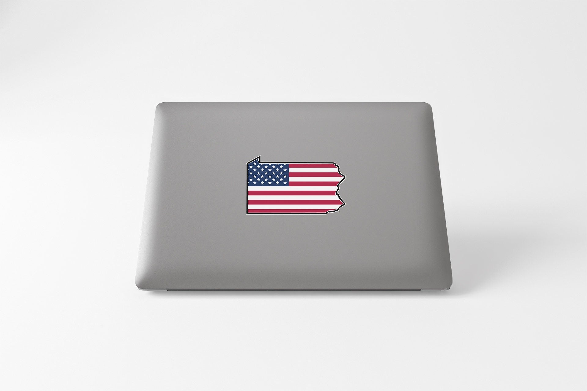 a laptop with a sticker of the state of indiana