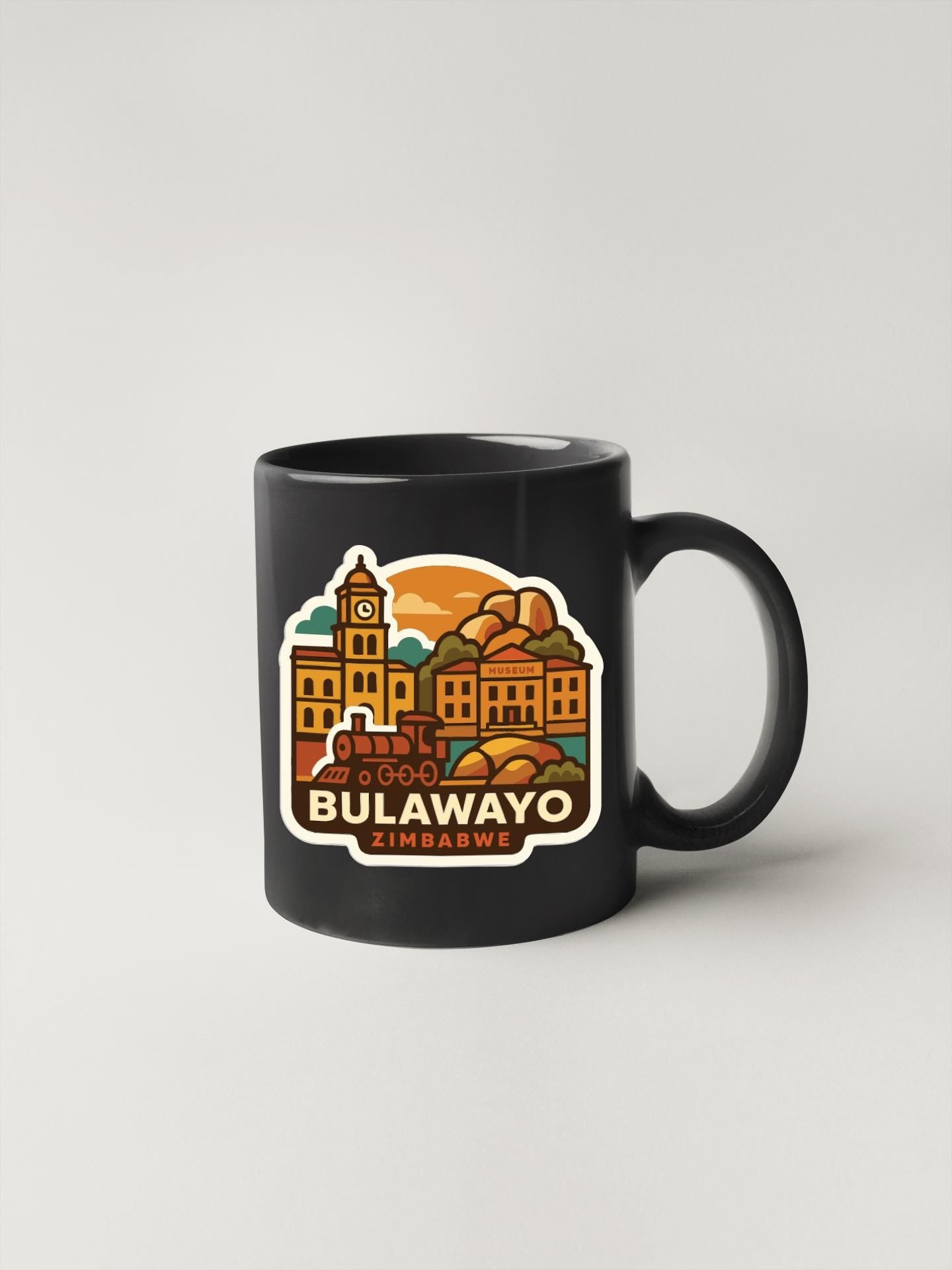 A black coffee mug with a colorful illustration of Bulawayo, Zimbabwe, featuring a clock tower and buildings.