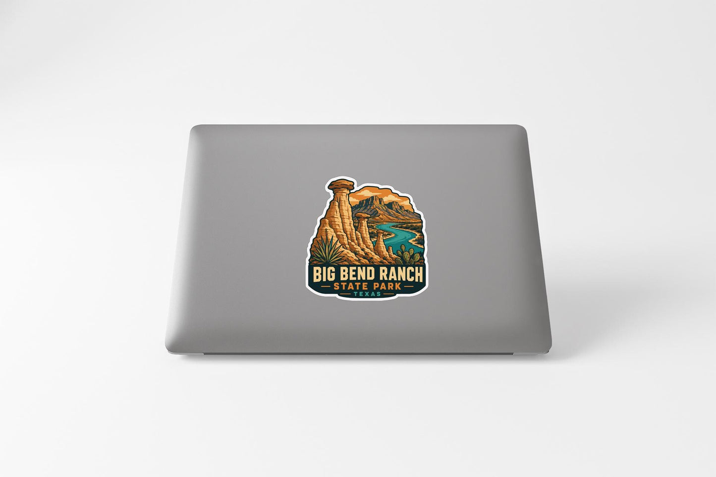 A sticker featuring an illustration of a scenic landscape with mountains, a river, and a tower, representing Big Bend Ranch State Park.