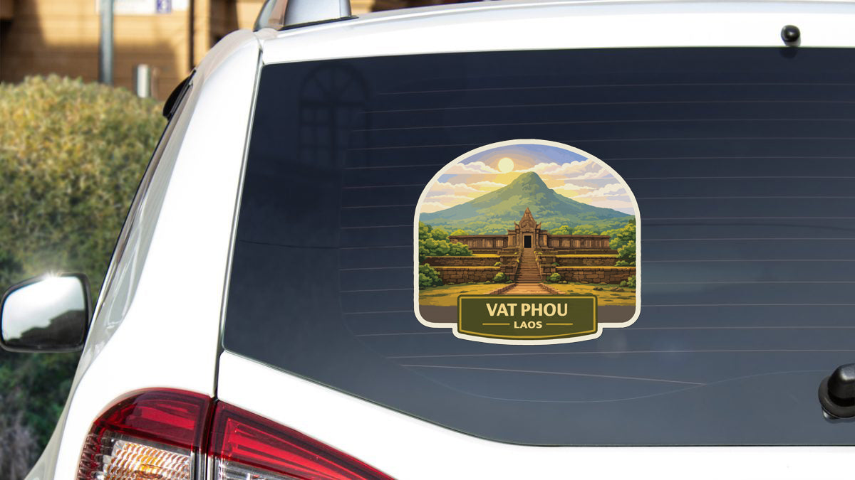 A sticker on the rear window of a car depicting a temple in Laos.