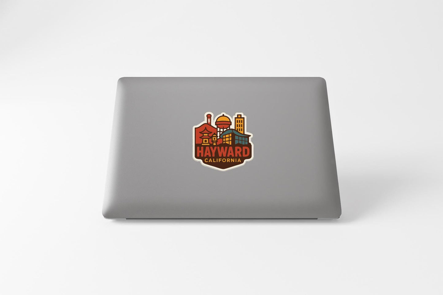 a sticker or decal of the town of Hayward, California, with various buildings and landmarks depicted in a stylized manner.