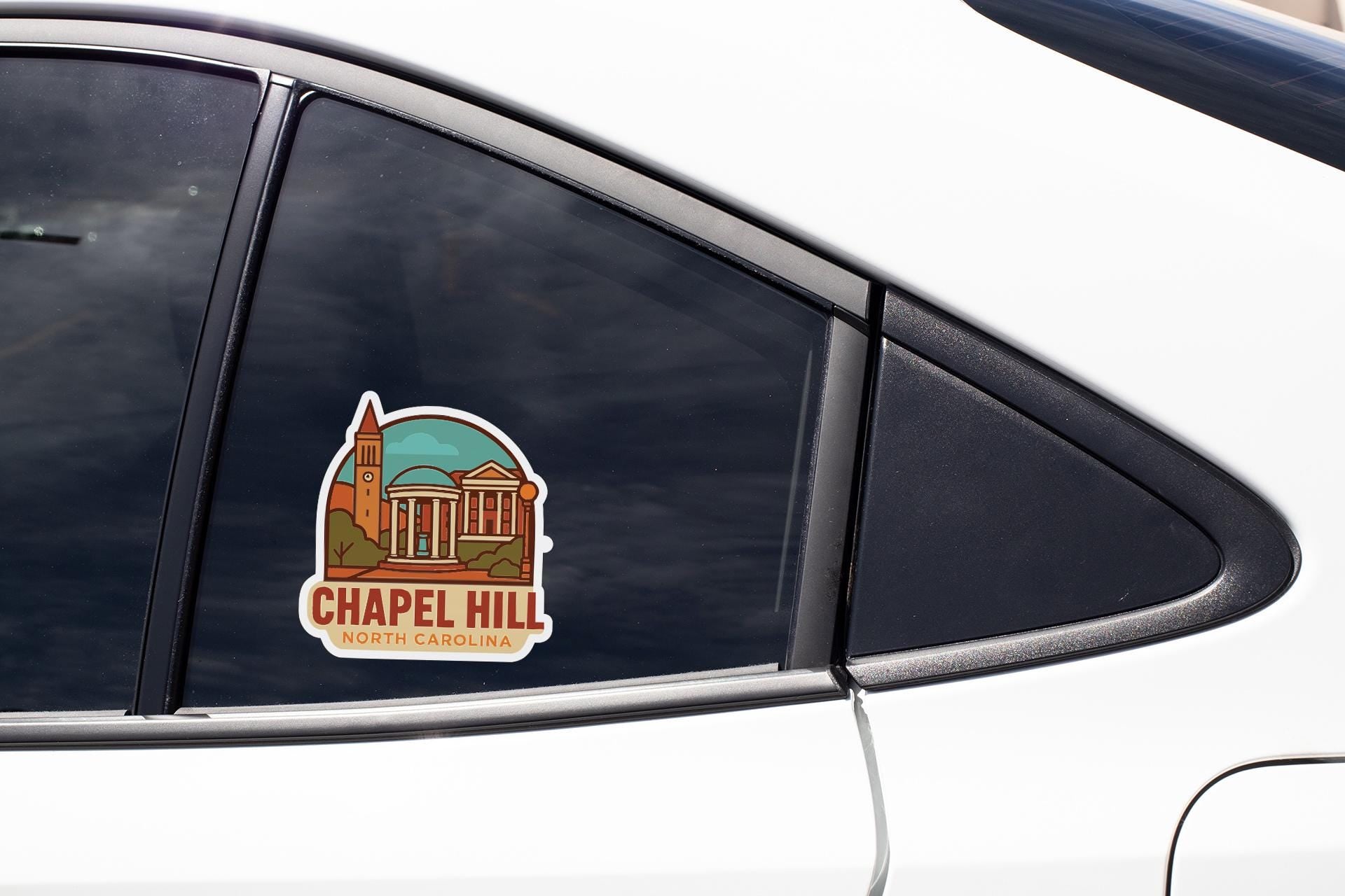 A sticker on the side of a car window, depicting a building with a dome and the text "Chapel Hill North Carolina".