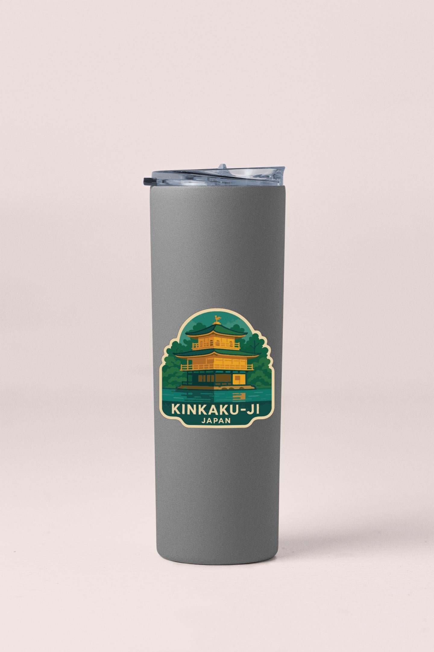 A gray insulated tumbler with a sticker depicting the Kinkaku-ji temple in Japan.