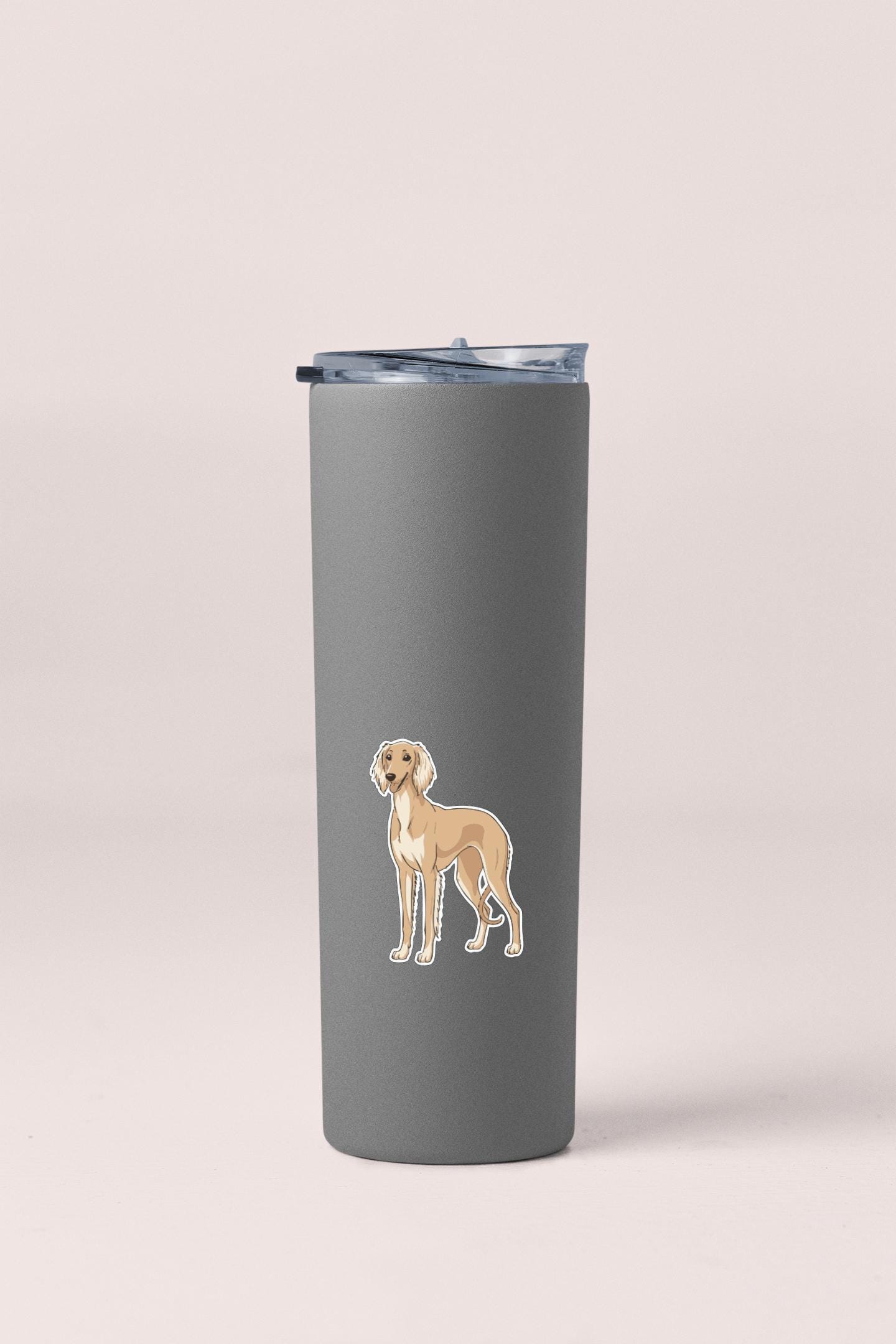 A gray insulated tumbler with a sticker of a dog on it.