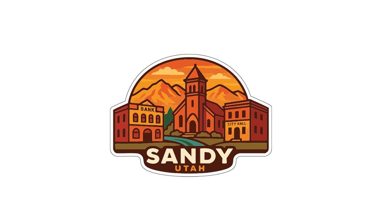 A sticker or emblem featuring a stylized illustration of a cityscape with buildings, mountains, and a church, along with the text "SANDY UTAH".
