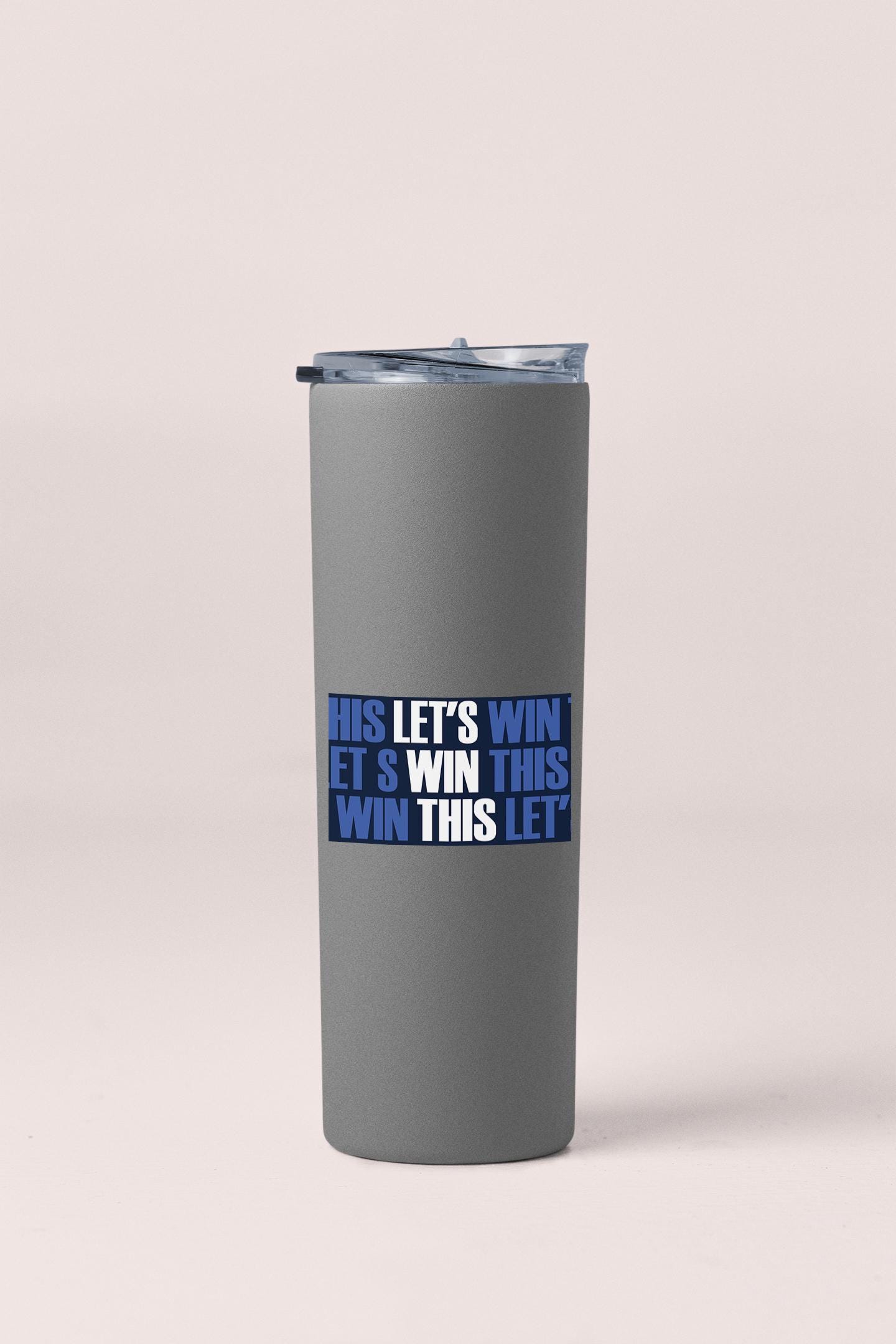 a stainless steel tumbler with the words, let's win it's