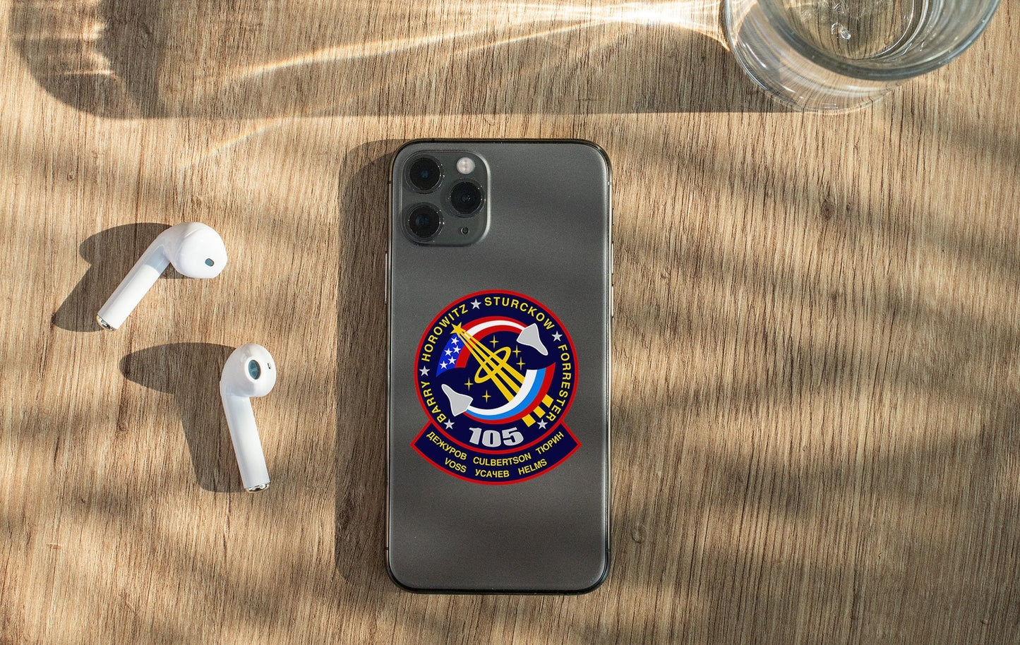 a cell phone sitting on top of a wooden table