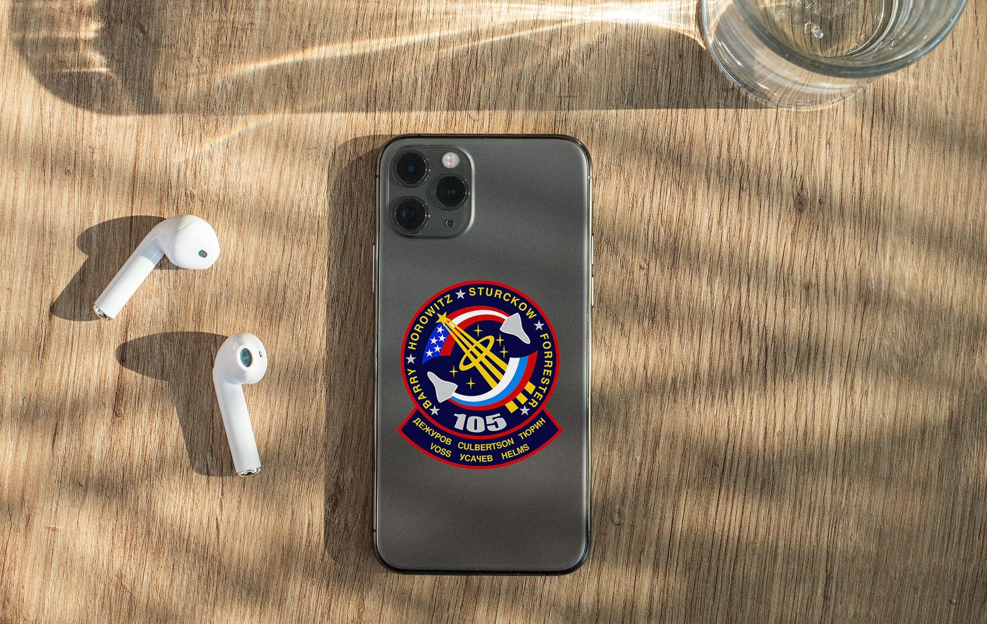 a cell phone sitting on top of a wooden table