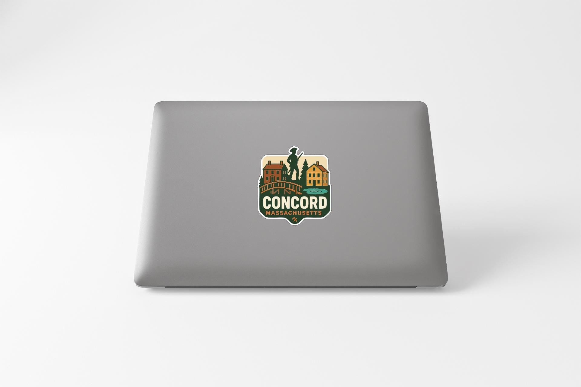 a sticker on the back of a laptop with a cityscape and the text "CONCORD" prominently displayed.