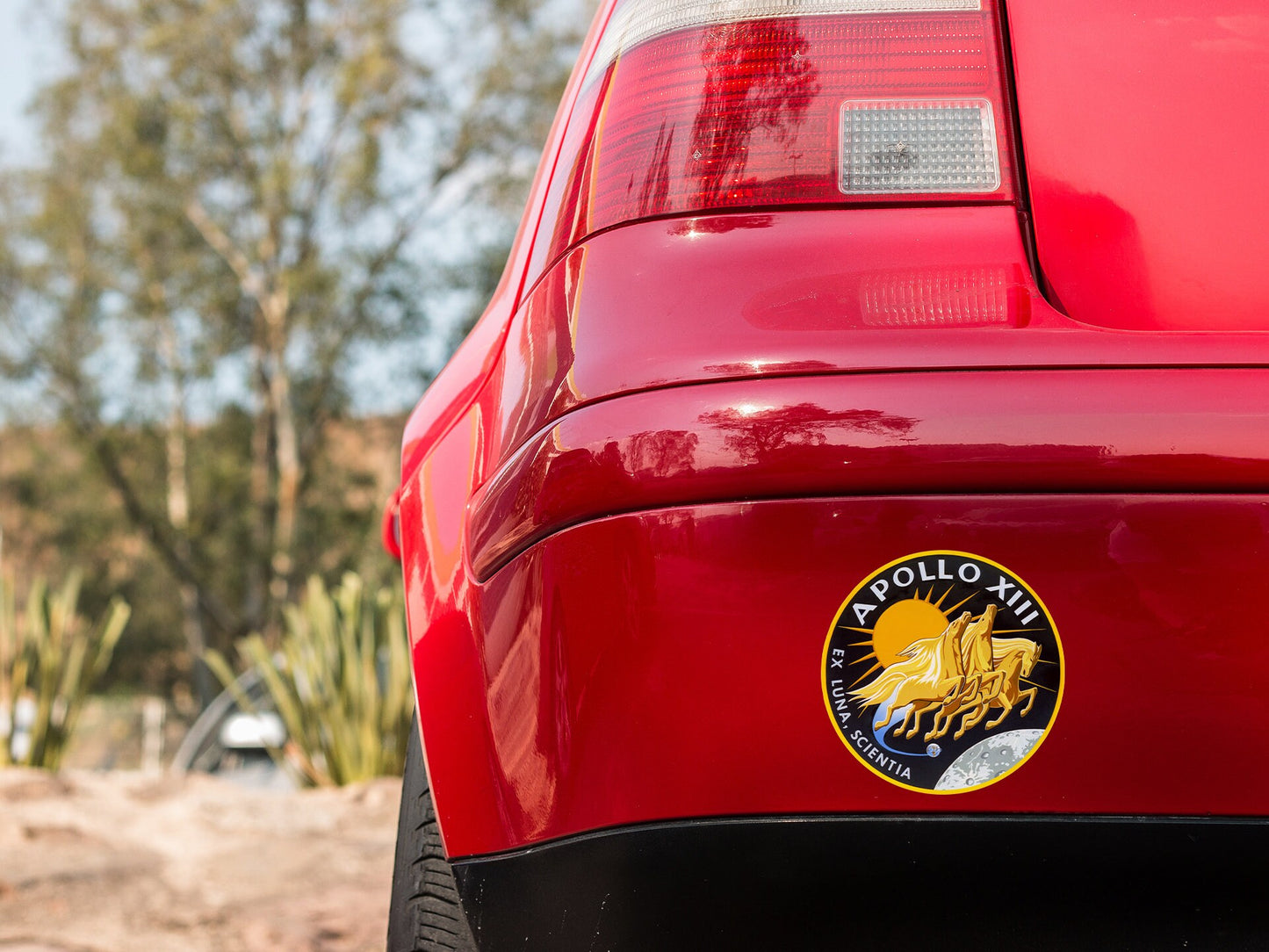 a close up of the tail end of a red car