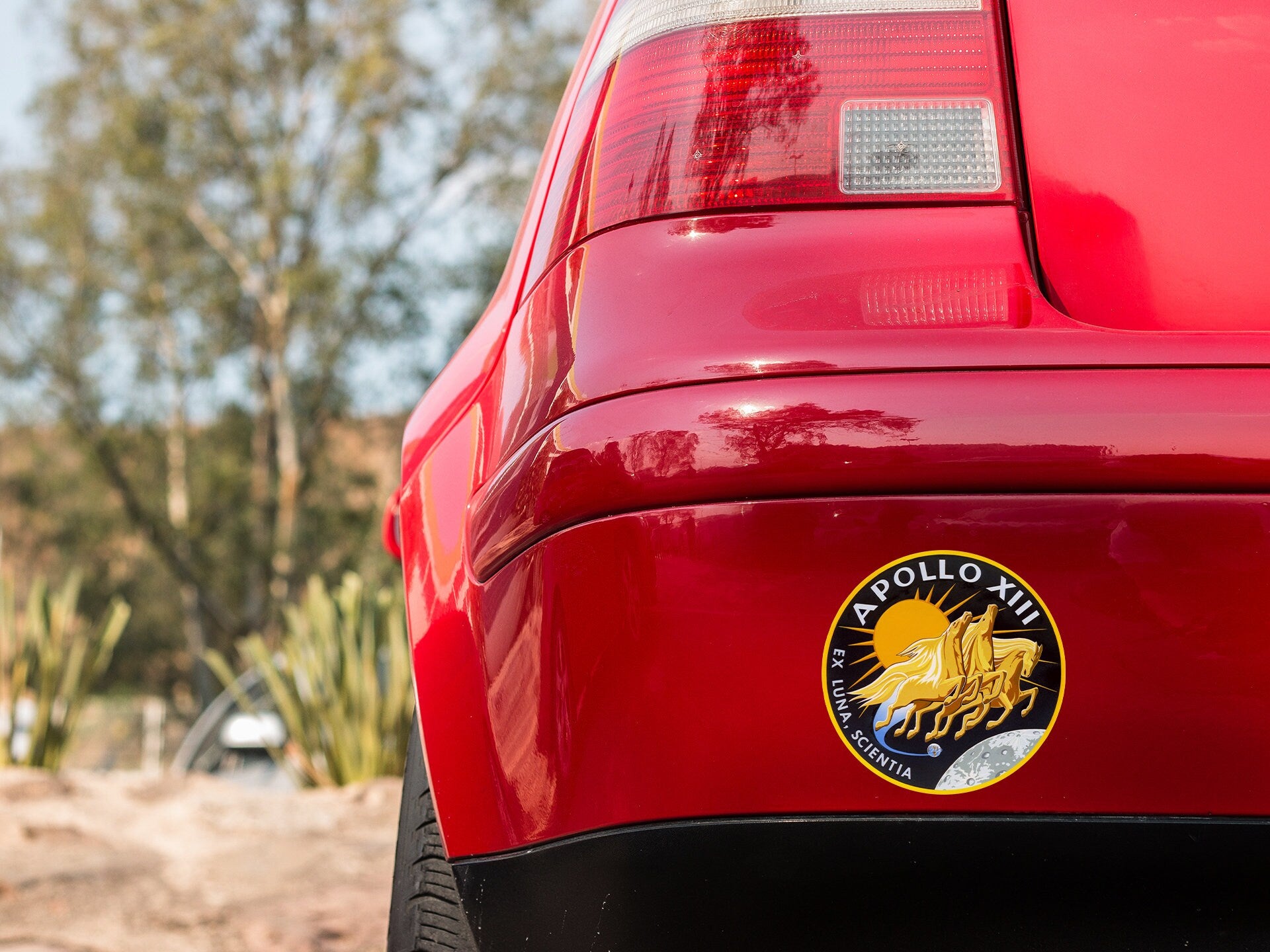 a close up of the tail end of a red car