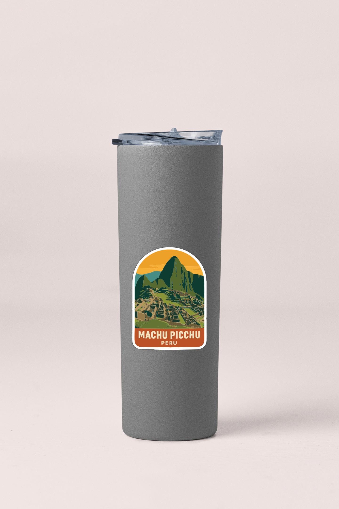 A gray tumbler with a label that says "MACHU PICCHU PECU".
