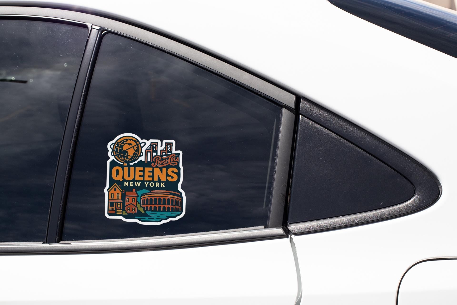 A sticker on the side of a car window, featuring an illustration of a city skyline and the text "Queens New York".