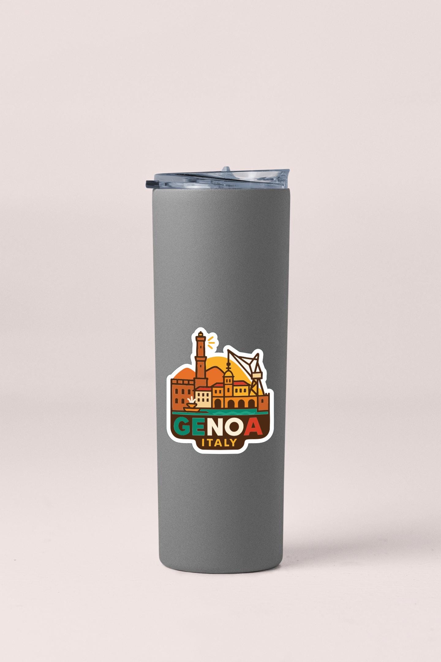 A gray insulated tumbler with a sticker depicting the Genoa, Italy skyline.