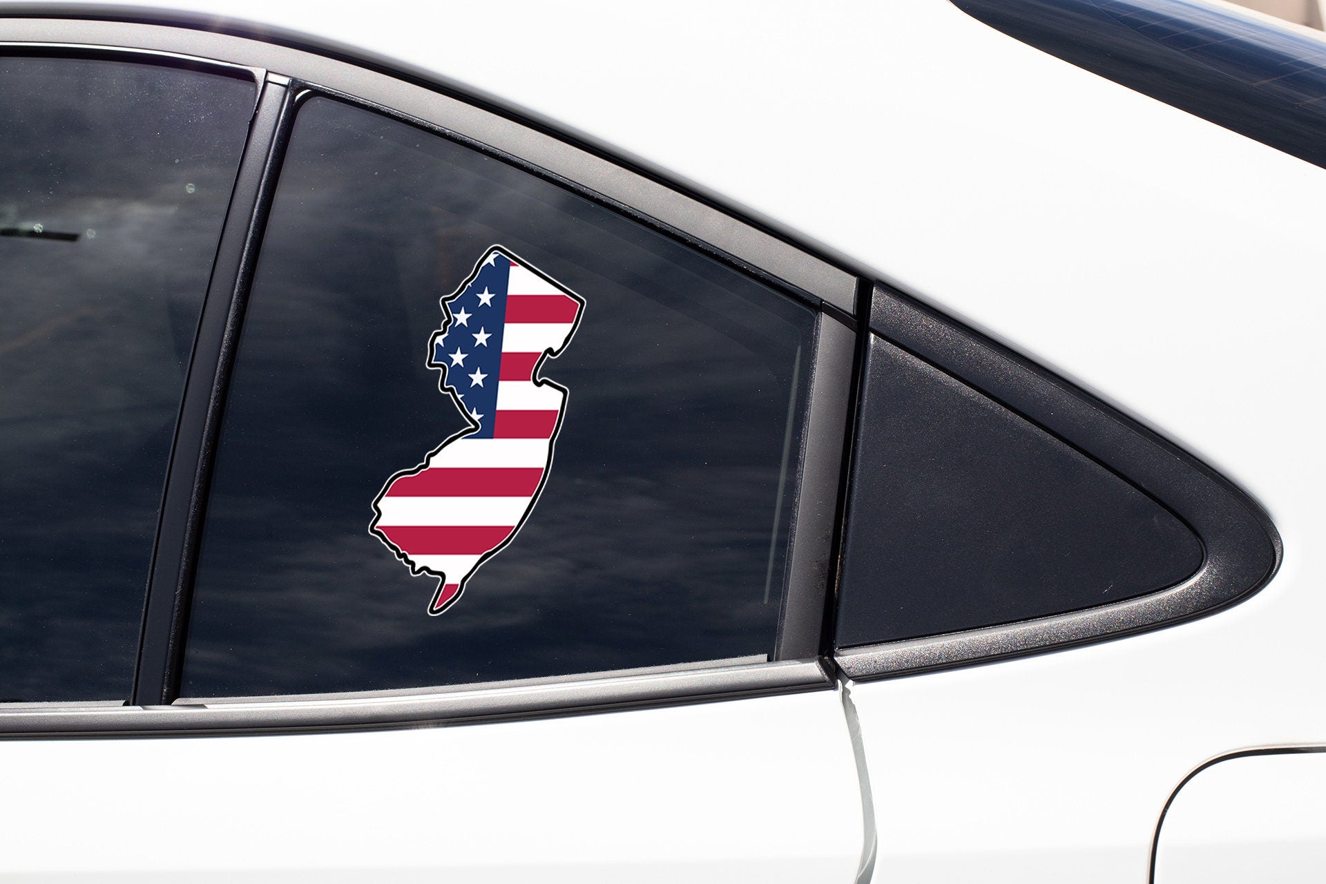 a car with a sticker of the state of rhode on it